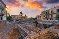 Beautiful old town of Taormina with small streets, flowers. Architecture with archs and old pavement in Taormina. Colorful narrow