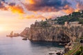 Beautiful old town of Taormina with small streets, flowers. Architecture with archs and old pavement in Taormina. Colorful narrow