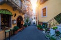 Beautiful old town of Taormina with small streets, flowers. Architecture with archs and old pavement in Taormina. Colorful narrow