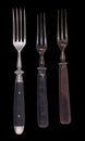 Beautiful old vintage forks isolated on black background. Top view. Retro silverware Royalty Free Stock Photo