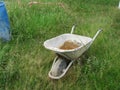 Beautiful old wheelbarrow worked old rusty transport