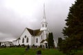 Old white country church  with approaching storm Royalty Free Stock Photo