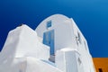 Beautiful old white ortodox church in sunny day with blue sky in Oia on Santorini island. Santorini is romantic place Royalty Free Stock Photo