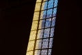 Window and a lamp in the german catholic church, black background Royalty Free Stock Photo