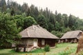 beautiful old wooden cabin cottage at mountains and woods, summer countryside, travel explore concept Royalty Free Stock Photo