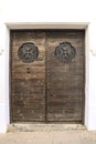 Old wooden door with wrought iron details Royalty Free Stock Photo