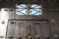 Old wooden door with wrought iron details Royalty Free Stock Photo