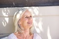 Beautiful older woman smiling outside looking relaxed Royalty Free Stock Photo