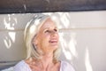 Beautiful older woman smiling outside looking relaxed