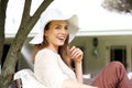 Beautiful older woman smiling with sun hat