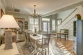 Beautiful open diningroom with light coming through door and windows