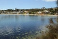 Beautiful Opossom Bay sparkling on a summer day at the end of South Arm near Hoabrt Tasmania. Royalty Free Stock Photo