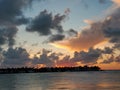 Beautiful orange blazing sunset view blue calm sea tropical with blue clouds over sky