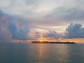 Beautiful orange blazing sunset view blue calm sea tropical with blue clouds over sky