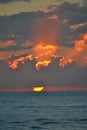 Beautiful orange blazing sunset view blue calm sea tropical with blue clouds over sky