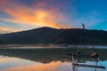 Beautiful orange and blue sky over the reflective lake water Royalty Free Stock Photo