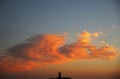 Beautiful Orange Clouds with Lighthouse Silhouette