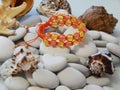 Beautiful orange friendship bracelet on the beach