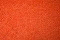 A beautiful orange natural-cotton towel background. Closeup of the grapefruit colored soft fiber texture Royalty Free Stock Photo