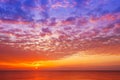 Beautiful, orange-pink sunset over the sea. Background image Royalty Free Stock Photo