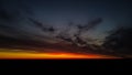 Beautiful orange and red sunset view with cumulus rain clouds from the drone view. Aerial landscape Royalty Free Stock Photo