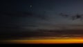 Beautiful orange and red sunset view with cumulus rain clouds and moon from drone view. Aerial landscape Royalty Free Stock Photo