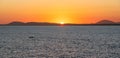 Orange sky at sunset off the coast of Uruguay