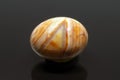 Beautiful orange agate stone on black background Royalty Free Stock Photo