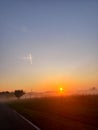 Beautiful orange sunrise with the morning fog