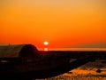 Beautiful Orange Sunset at beach wooden boat silhouettes sun rise Royalty Free Stock Photo