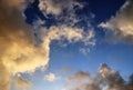 Beautiful orange sunset cloud formations on a deep blue sky Royalty Free Stock Photo