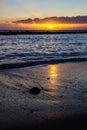 Beautiful Orange Sunset Over Beach with Clouds Royalty Free Stock Photo