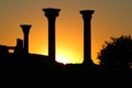 Beautiful sunset with silhouette of ancient columns at Chersonese of Taurida, Crimea. Royalty Free Stock Photo