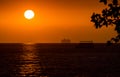 View of orange sunset sky over the ocean.