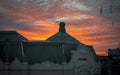 Beautiful orange yellow dusk sunset, over the old building of Politehnica university in Timi?oara, Romania. Royalty Free Stock Photo