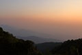 Beautiful orange and yellow sunset and layers of silhouettes mountain in Chiang Mai , Thailand