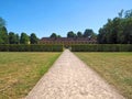 Beautiful orangery at the castle Schloss Benrath in Duesseldorf in Germany with a big park and white sculptures