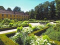 Beautiful orangery at the castle Schloss Benrath in Duesseldorf in Germany with a big park and white sculptures