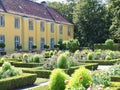 Beautiful orangery at the castle Schloss Benrath in Duesseldorf in Germany with a big park and white sculptures