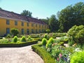 Beautiful orangery at the castle Schloss Benrath in Duesseldorf in Germany with a big park and white sculptures