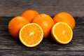 Beautiful Oranges Fruit Full and Sliced on old wooden table. rich with vitamins. background, texture Royalty Free Stock Photo