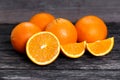 Beautiful Oranges Fruit Full and Sliced on old wooden table. rich with vitamins. background, texture Royalty Free Stock Photo