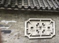 Beautiful Oriental Traditional Wall Motif on Grey Stone Wall in Guangzhou, China