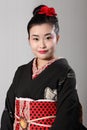 Beautiful oriental woman in black japanese kimono Royalty Free Stock Photo