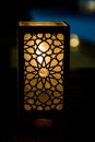 Original oriental lamp shining with warm light during the coming dark