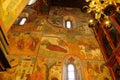 Beautiful ornate painted interior of Orthodox Church. Old frescoes with icons inside luxury Russian cathedral. Moscow Royalty Free Stock Photo