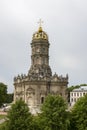 Beautiful Orthodox Christian church in village Dubrovitsy Russia. Znamenskaya church with a single golden dome, many Royalty Free Stock Photo
