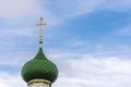 Beautiful Orthodox church dome with a cross on a background of the cloudy sky. Royalty Free Stock Photo