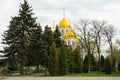 Beautiful Orthodox Church, play of light on the gilded dome, sky in the background. Royalty Free Stock Photo