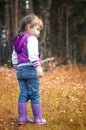 Beautiful outdoor autumn portrait of adorable toddler girl